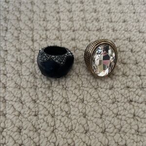 Set of two fun costume jewelry rings, one leather one adjustable metal